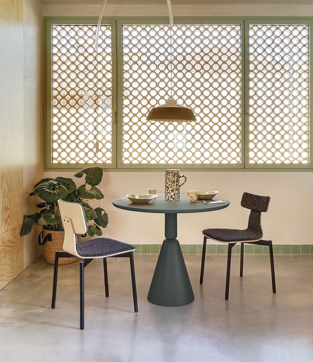 Pion Dining Table by Sancal in a dining nook with a lattice screen – In Dubai by WSPR