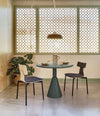 Pion Dining Table by Sancal in a dining nook with a lattice screen – In Dubai by WSPR