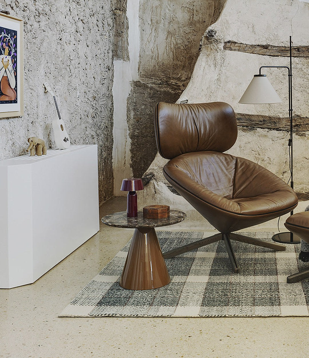 Pion Side Table by Sancal in brown by a leather lounge chair – In Dubai by WSPR