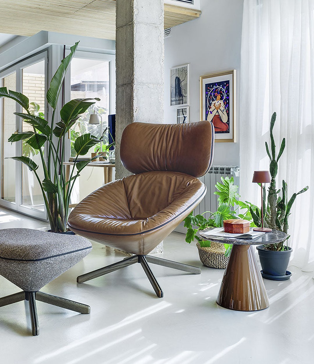 Pion Side Table by Sancal in brown by a leather lounge chair, wide view – In Dubai by WSPR