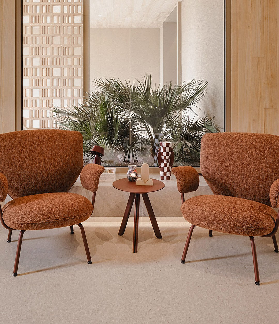 Planta Armchair by Sancal two armchairs in rust with a side table – In Dubai by WSPR
