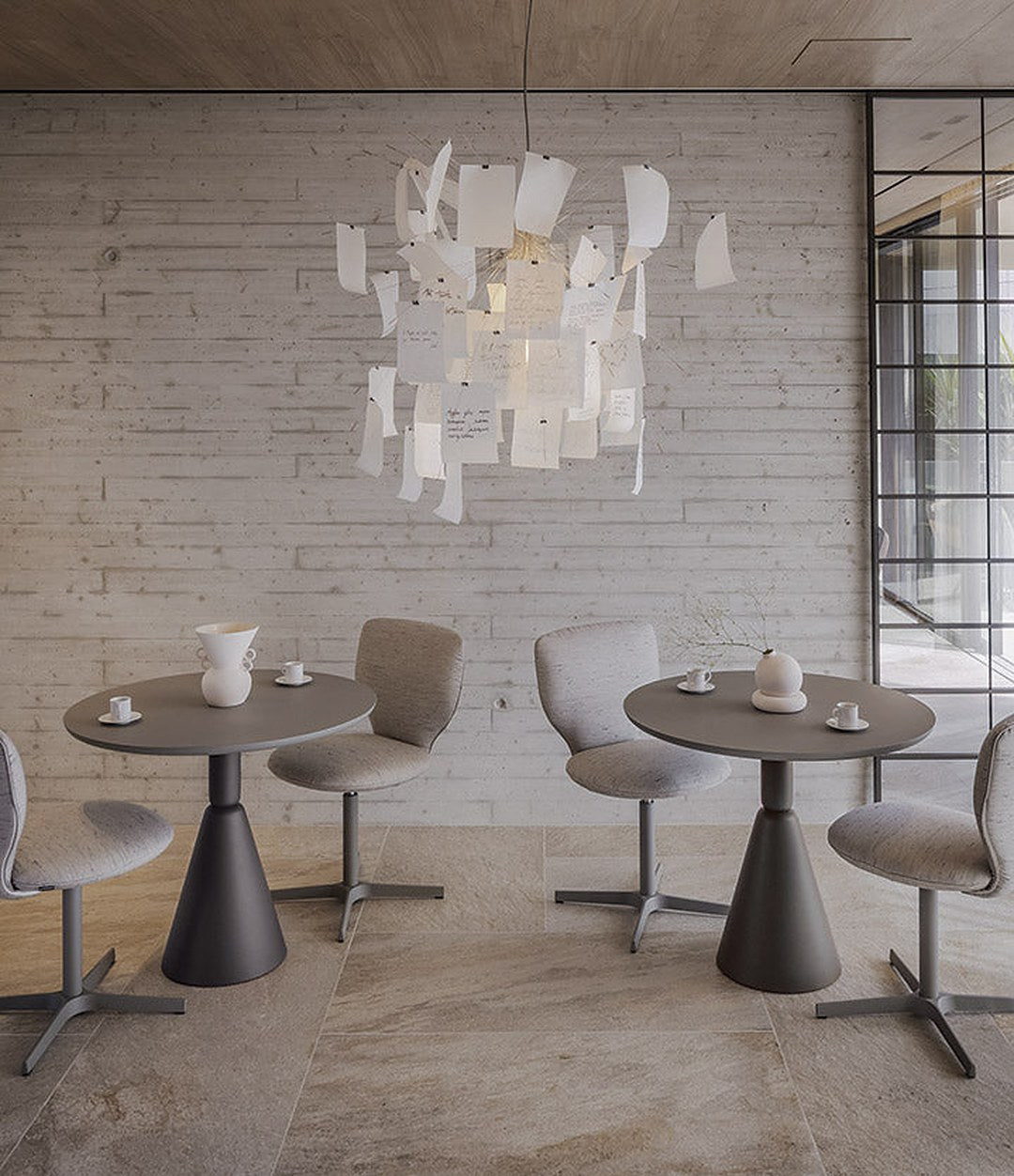 Planta Chair by Sancal in grey around café tables – In Dubai by WSPR