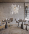 Planta Chair by Sancal in grey around café tables – In Dubai by WSPR