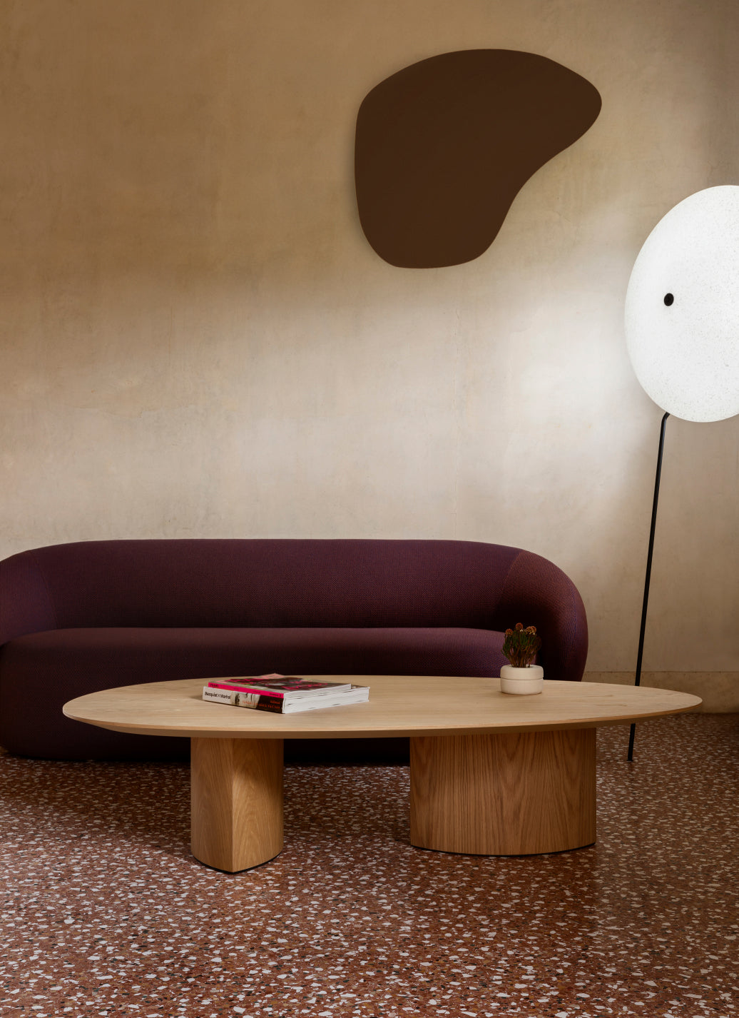 Plautino Coffee Table by Miniforms in oak, styled in front of a plum sofa – In Dubai by WSPR