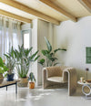 Remnant Armchair by Sancal in beige among plants – In Dubai by WSPR
