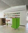Rew Room by Sancal armchairs in green in a library, wide view – In Dubai by WSPR
