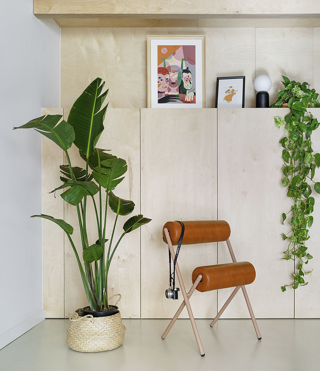 Roll Chair by Sancal in tan by a plant – In Dubai by WSPR