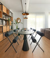 Roll Chair by Sancal in black around a round dining table – In Dubai by WSPR