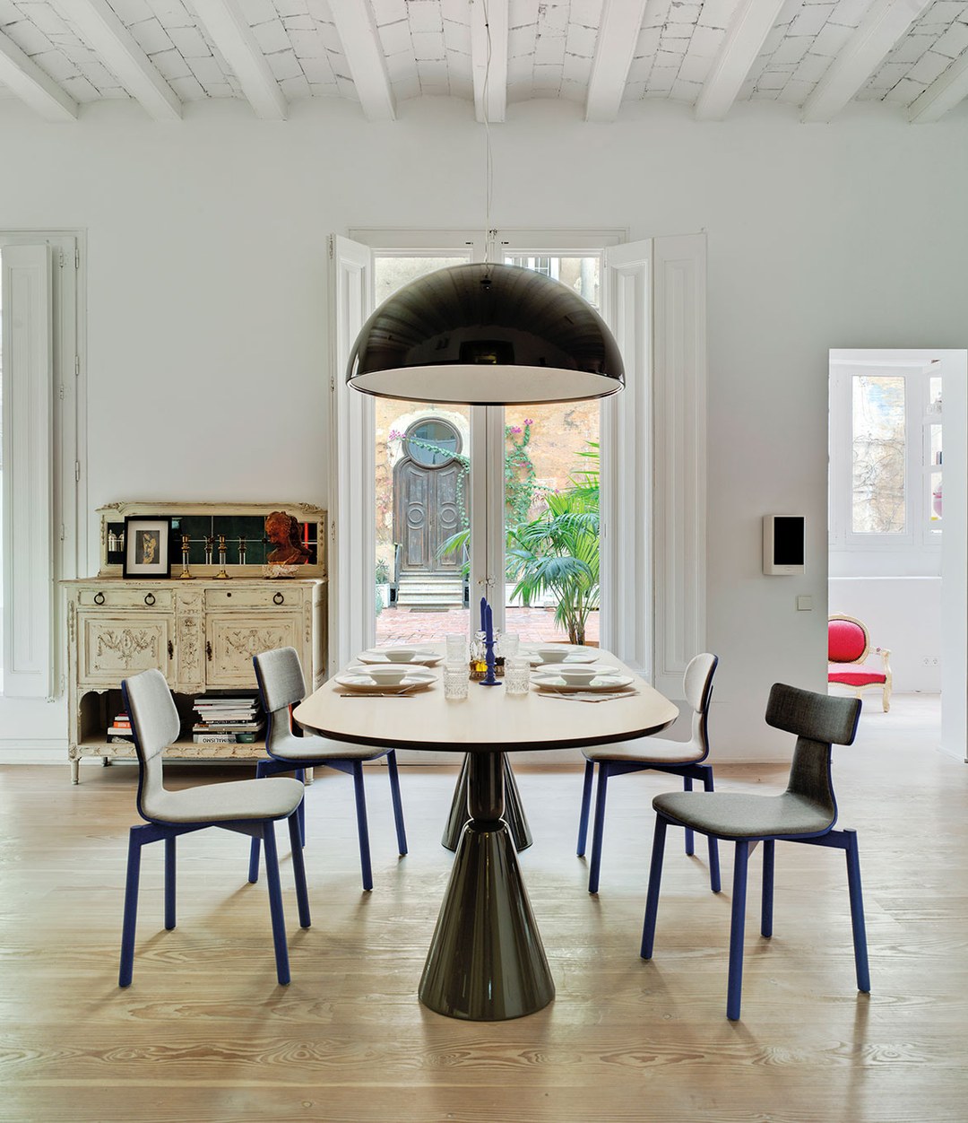 Silla40 Chair by Sancal in blue around a dining table – In Dubai by WSPR