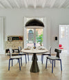 Silla40 Chair by Sancal in blue around a dining table – In Dubai by WSPR