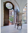 Silla40 Chair by Sancal by an arched doorway – In Dubai by WSPR