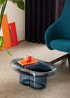 Soda Oval Coffee Table by Miniforms styled in blue blown glass beside a teal armchair – In Dubai by WSPR