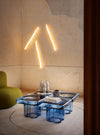 Soda SQ Coffee Table by Miniforms styled in a warm interior, in blue blown glass with wall lights – In Dubai by WSPR