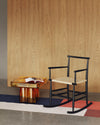 Soda SQ Coffee Table by Miniforms styled beside a black rocking chair, in amber blown glass – In Dubai by WSPR