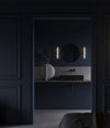 Stick Wall Lamp by 101 Copenhagen in Bronze in a styled interior, view 3 – In Dubai by WSPR
