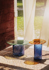 Striche Coffee Table by Miniforms styled outdoors beside sheer curtains on terrazzo – In Dubai by WSPR