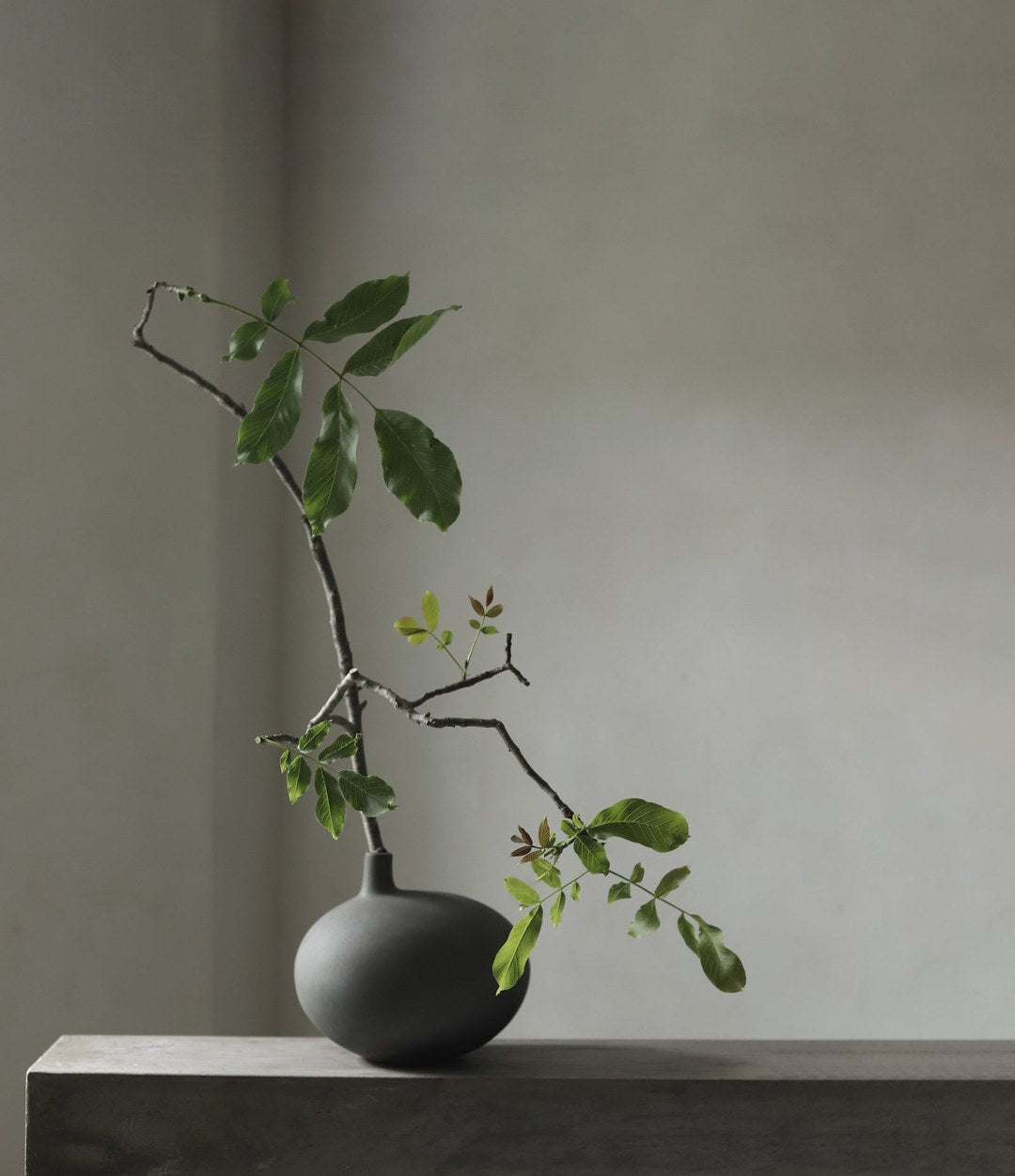 Submarine Vase, Small by 101 Copenhagen in Dark Grey in a styled interior – In Dubai by WSPR