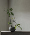 Submarine Vase, Small by 101 Copenhagen in Dark Grey in a styled interior – In Dubai by WSPR