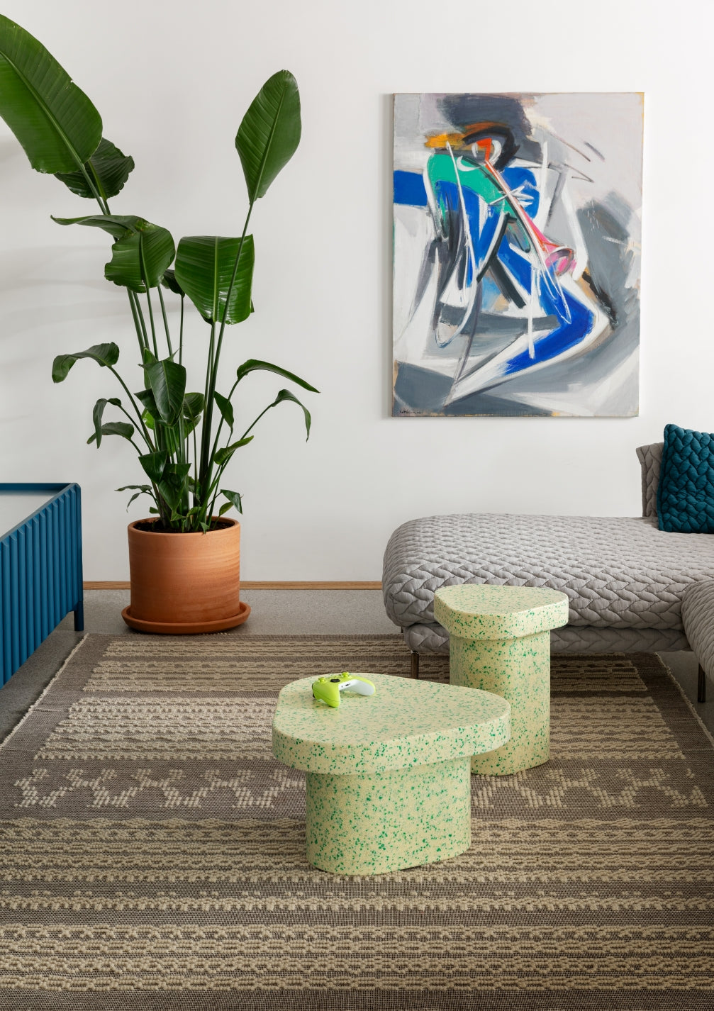 Superpop Coffee Table by Miniforms styled in a bright living room with a sofa, patterned rug and large plant – In Dubai by WSPR