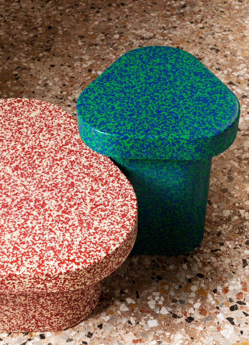 Superpop Coffee Table by Miniforms styled in red and green speckled polyethylene on a terrazzo floor, close view – In Dubai by WSPR