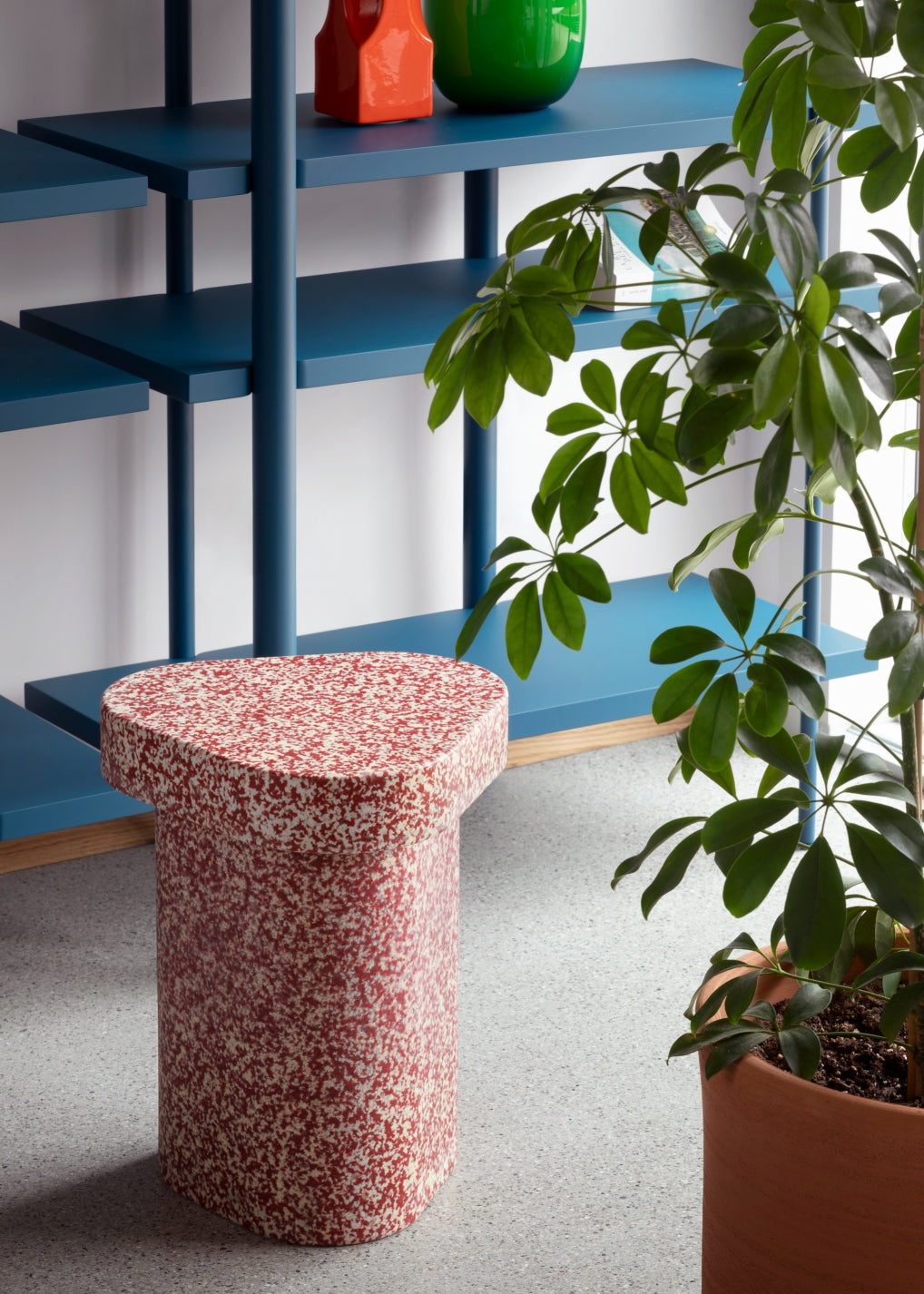 Superpop Coffee Table by Miniforms styled beside a blue shelving unit and a potted plant – In Dubai by WSPR