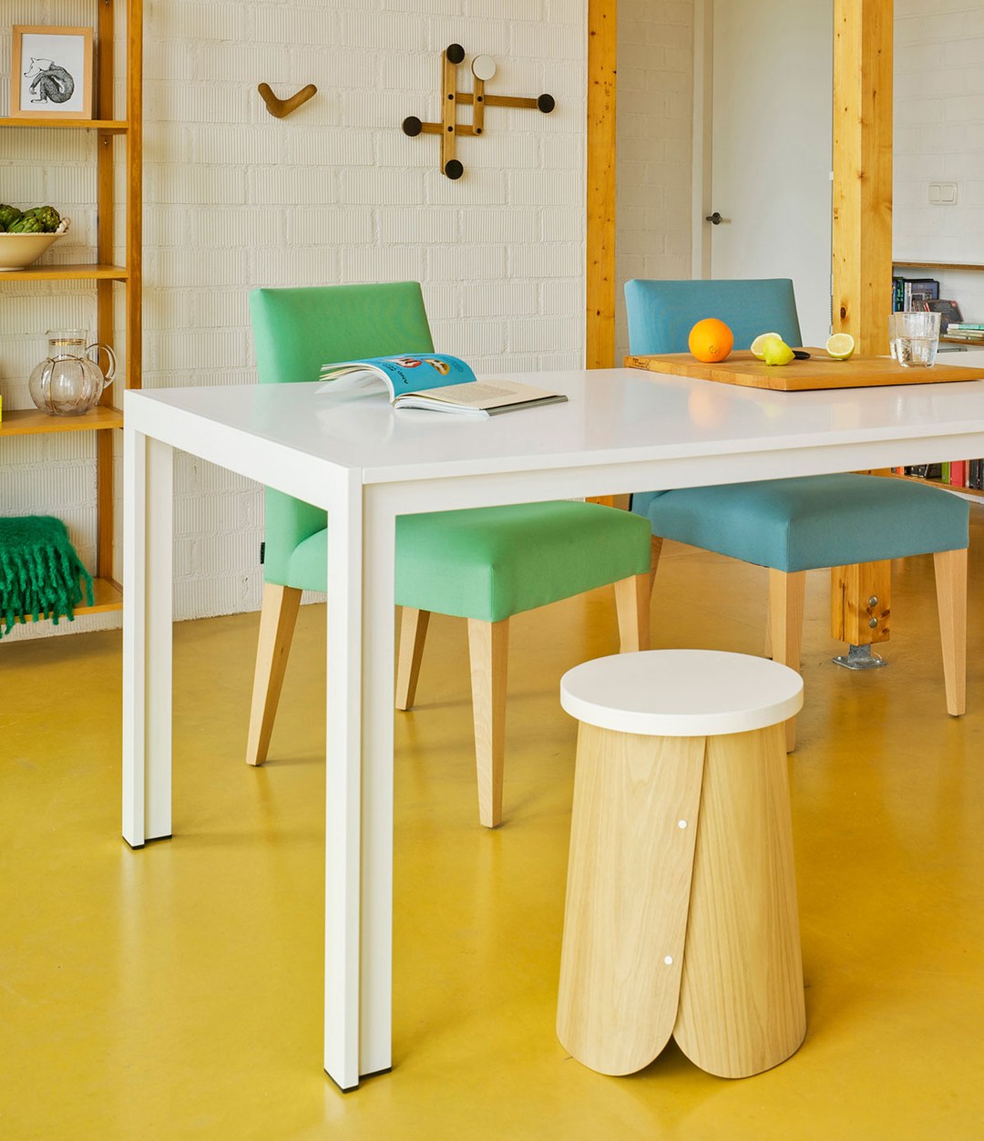 Tab Stool by Sancal with a white top by a white table – In Dubai by WSPR