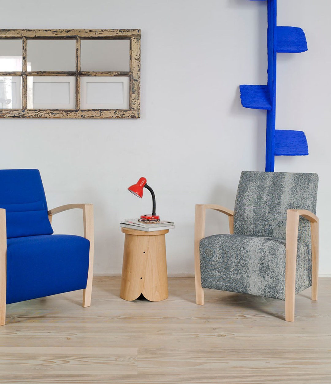 Tab Stool by Sancal beside blue and grey armchairs – In Dubai by WSPR