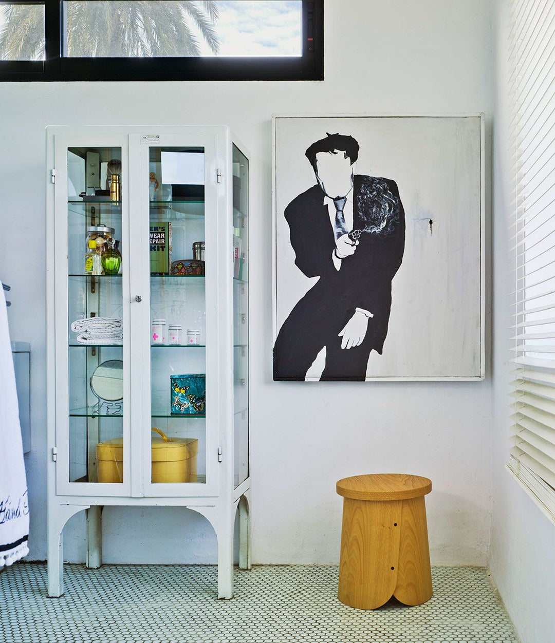 Tab Stool by Sancal in a hallway by a glass cabinet – In Dubai by WSPR