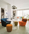 Tea Lounge Chair by Sancal in blue and orange around a table – In Dubai by WSPR