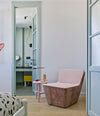 Tea Lounge Chair by Sancal in pink by a window – In Dubai by WSPR