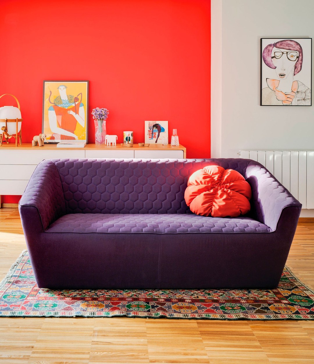 Tea Sofa by Sancal in purple in a red room – In Dubai by WSPR