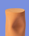 Toblo Coffee Table by Miniforms in natural baked clay, front view against a blue backdrop – In Dubai by WSPR