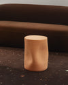 Toblo Coffee Table by Miniforms in natural baked clay, styled in front of a brown curved sofa – In Dubai by WSPR