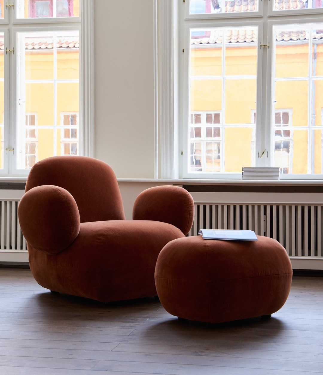 Toe Ottoman by 101 Copenhagen in Rust in a styled interior – In Dubai by WSPR