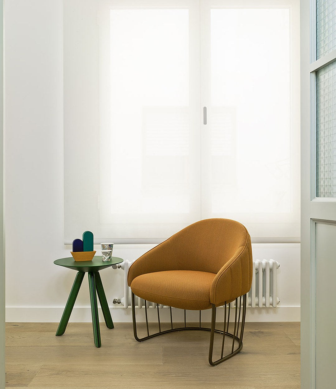 Tonella Lounge Chair by Sancal in mustard by a window – In Dubai by WSPR