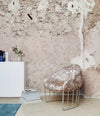 Tonella Lounge Chair by Sancal in patterned fabric against a rough wall – In Dubai by WSPR