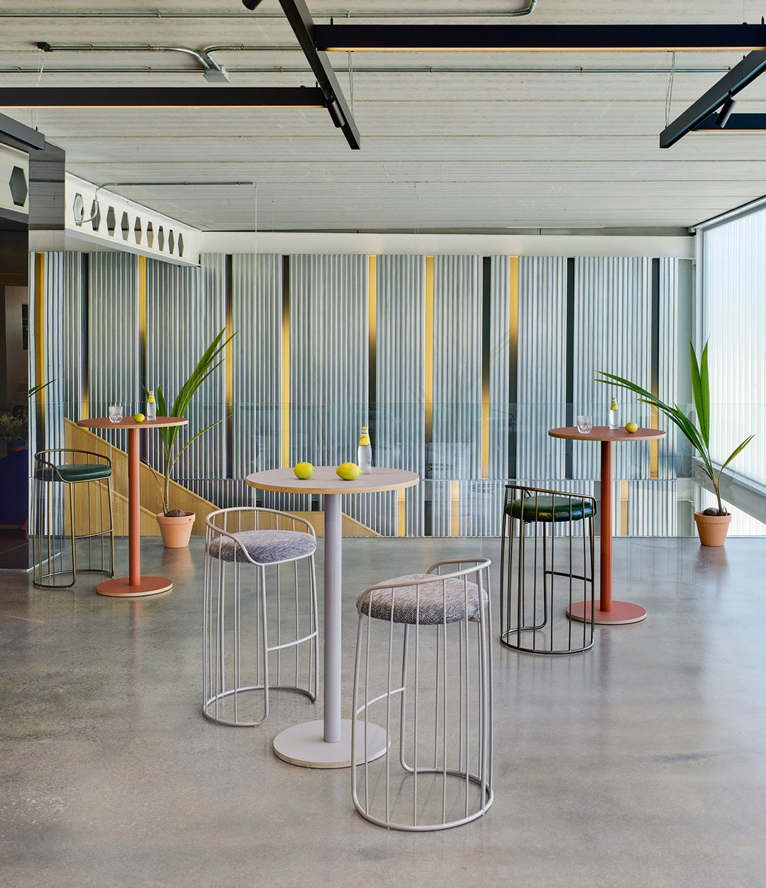 Tonella Stool by Sancal at high tables in a loft – In Dubai by WSPR