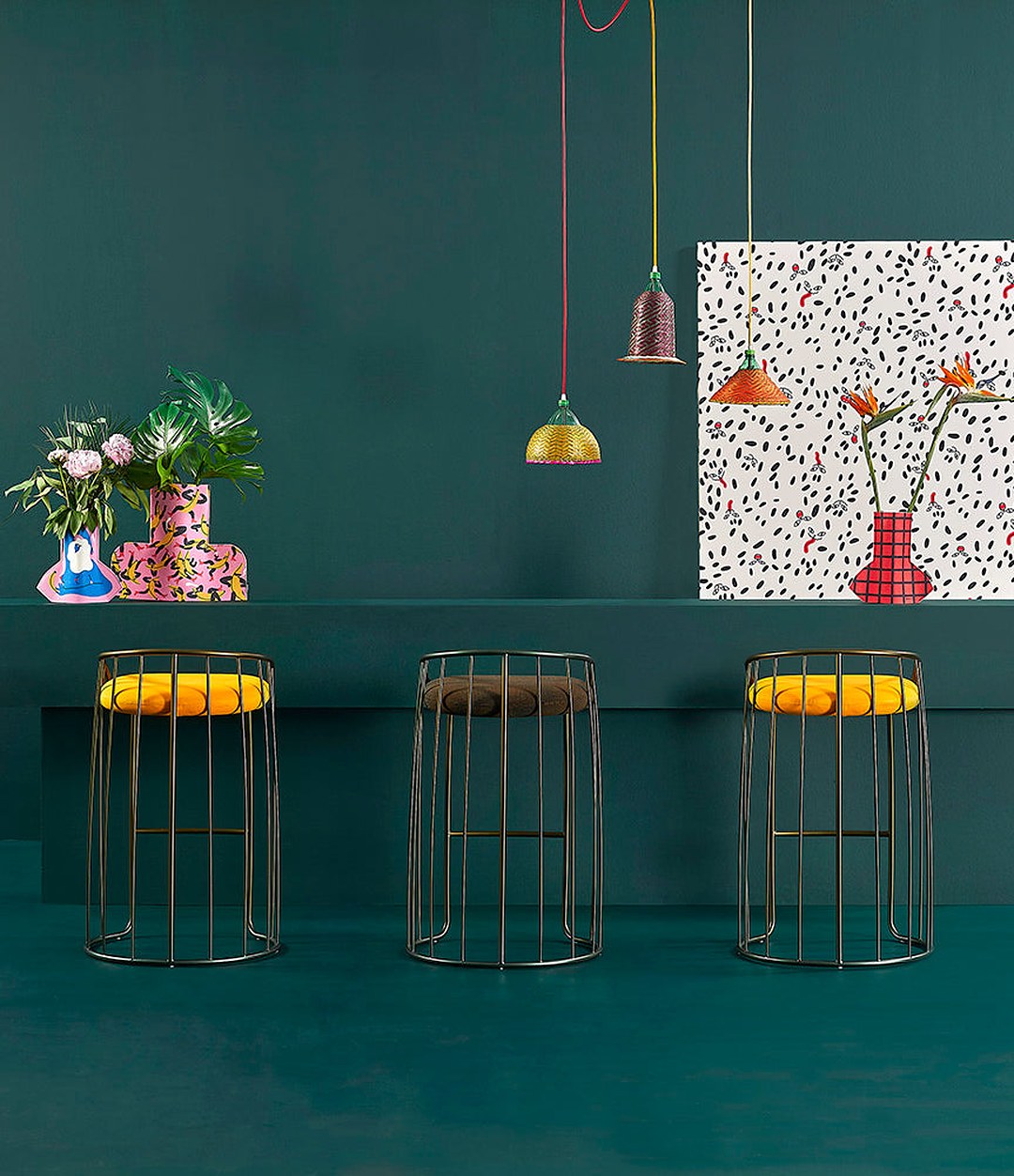 Tonella Stool by Sancal in yellow at a green counter – In Dubai by WSPR