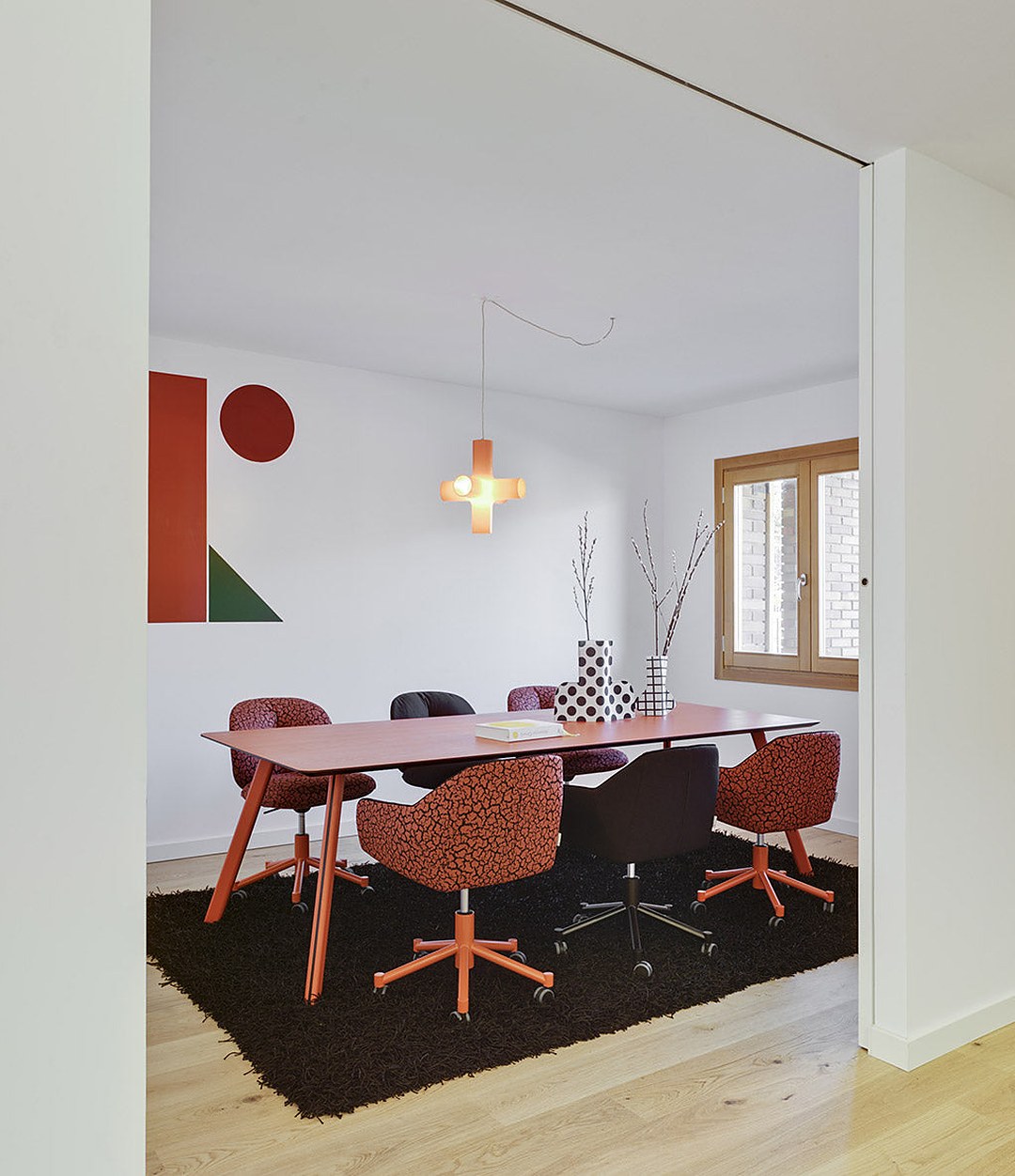 Tortuga Dining Table by Sancal in red in a meeting room – In Dubai by WSPR