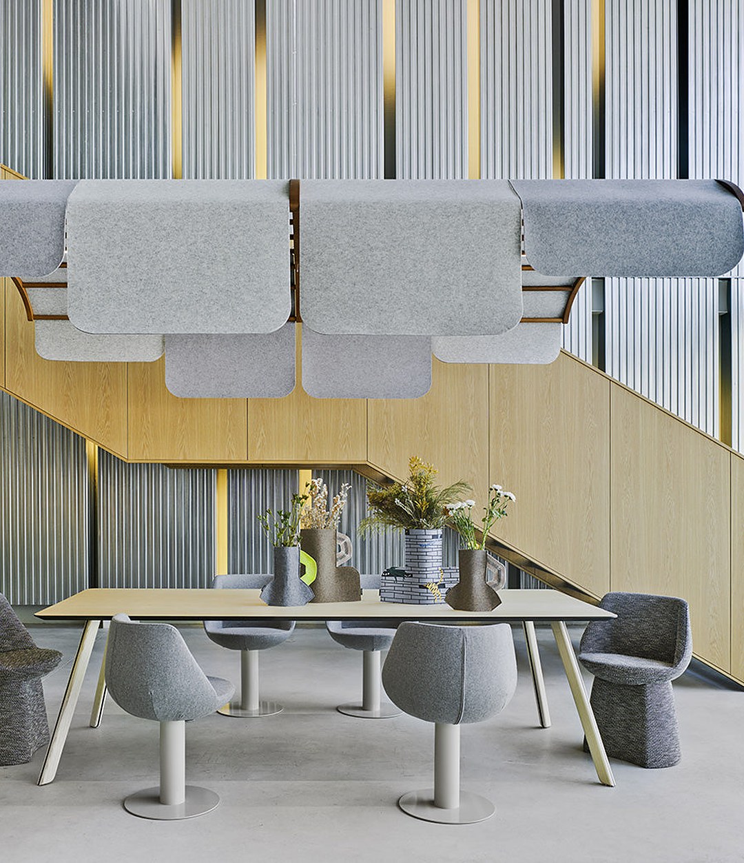 Tortuga Dining Table by Sancal long table in natural ash under an acoustic canopy – In Dubai by WSPR