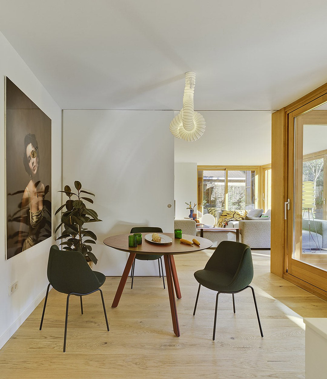 Tortuga Dining Table by Sancal round in red by a window – In Dubai by WSPR