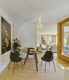 Tortuga Dining Table by Sancal round in red by a window – In Dubai by WSPR