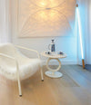 Totem Side Table by Sancal in white beside a sheepskin chair – In Dubai by WSPR