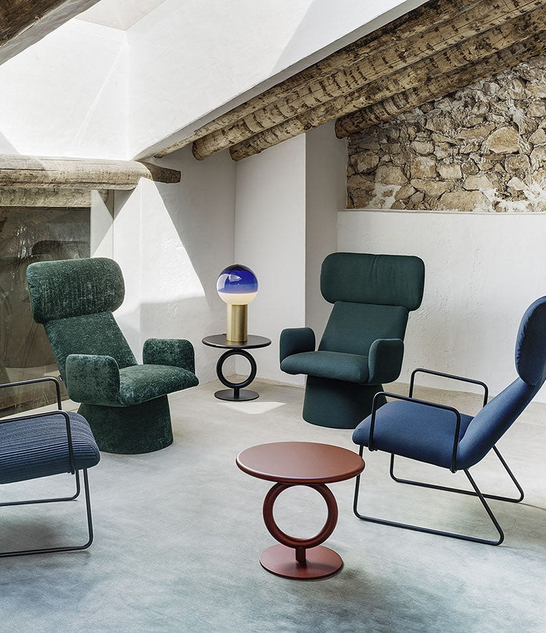 Totem Side Table by Sancal in red among blue armchairs – In Dubai by WSPR