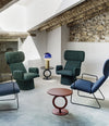 Totem Side Table by Sancal in red among blue armchairs – In Dubai by WSPR