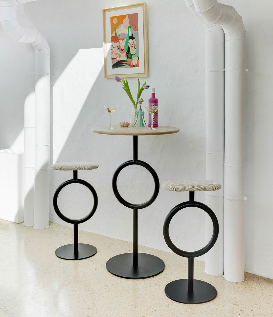 Totem Stool by Sancal in black around a high table – In Dubai by WSPR