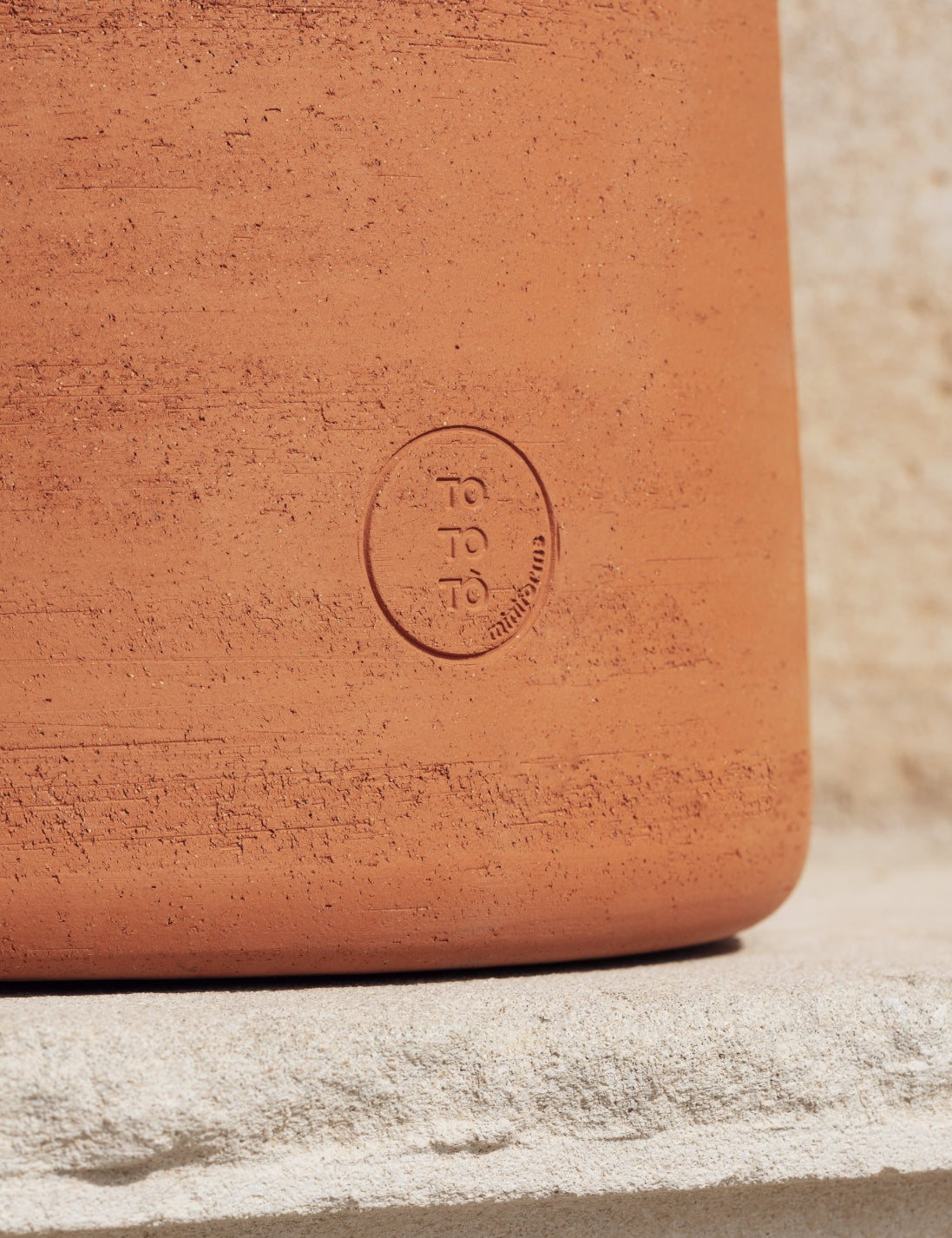 Tototò Coffee Table by Miniforms in natural terracotta, close detail of the embossed mark – In Dubai by WSPR