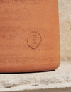 Tototò Coffee Table by Miniforms in natural terracotta, close detail of the embossed mark – In Dubai by WSPR