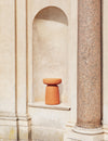Tototò Coffee Table by Miniforms in natural terracotta, set in a stone alcove – In Dubai by WSPR