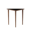 Umanoff Nesting Side Table by Audo in walnut with a black laminate top, front view – In Dubai by WSPR